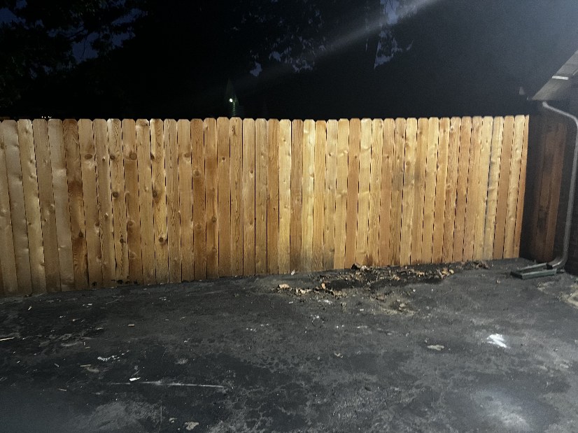 The same fence line with all bins, plywood and buckets hauled away
